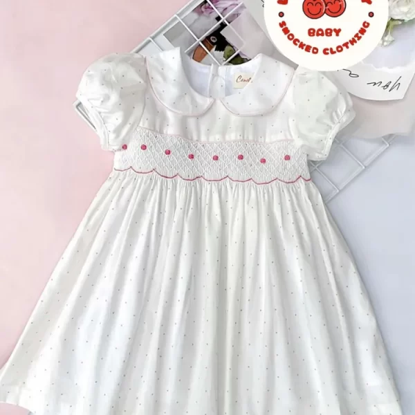 White fabric with red dots geo smocked dress