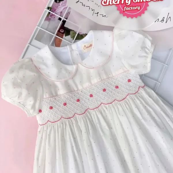 White fabric with red dots geo smocked dress
