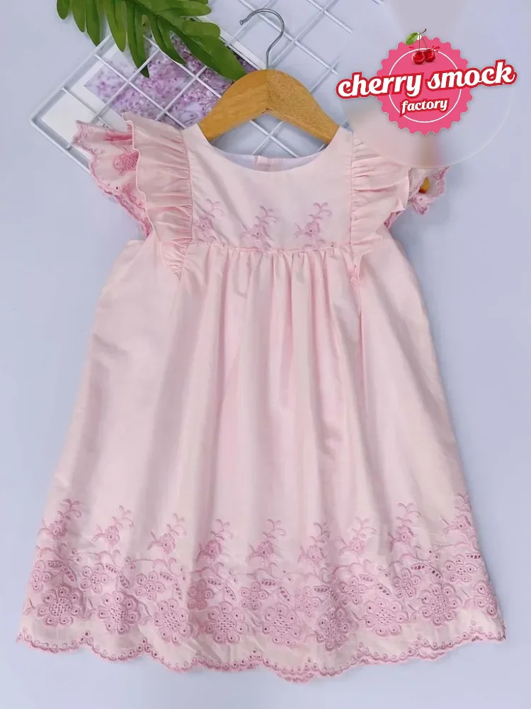 Embroidered pink and white dress from Cherrysmock, suited to UK boutique wholesale ranges