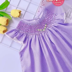 Purple smocked bishop dress with small flower pattern