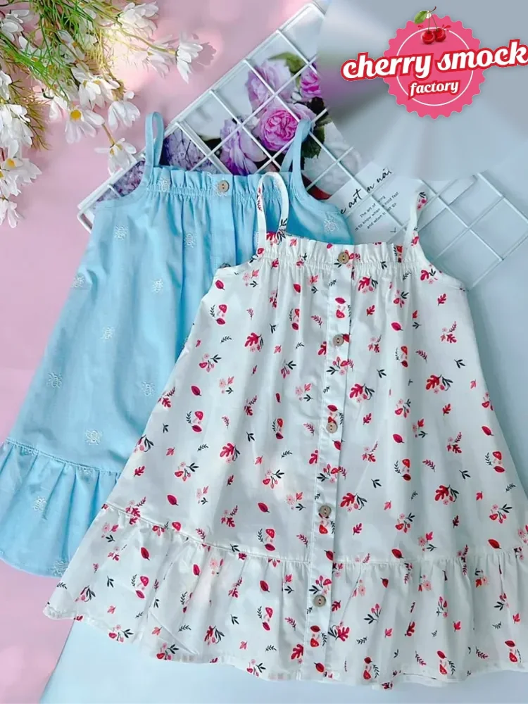 Two-string girls dress with hand smocked details, a design boutiques can order from 30 pieces per design
