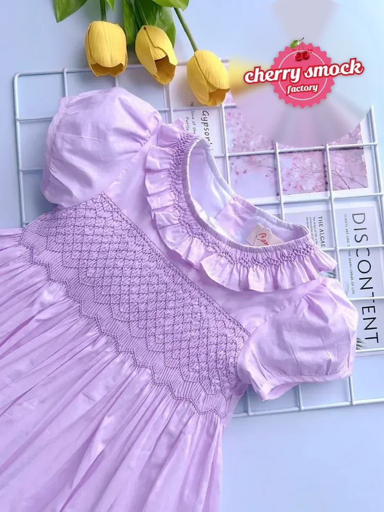 Pink geometric smocked princess dress with puff sleeves, a design available from 30 pieces per design