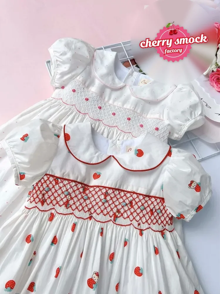 Strawberry white smocked princess dress, a hand smocked best seller style from Cherrysmock