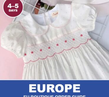 White hand-smocked dress with red details from Cherrysmock for European boutique wholesale